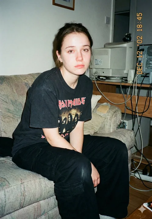 Tired Girl Under the Millennium Flashbulb