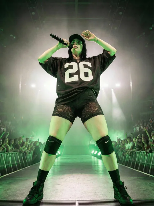 Dominant female singer on the green light stage
