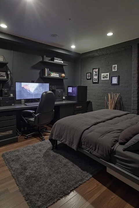 Photographie intérieure d'une chambre de jeu moderne à thème sombre et d'une zone de travail