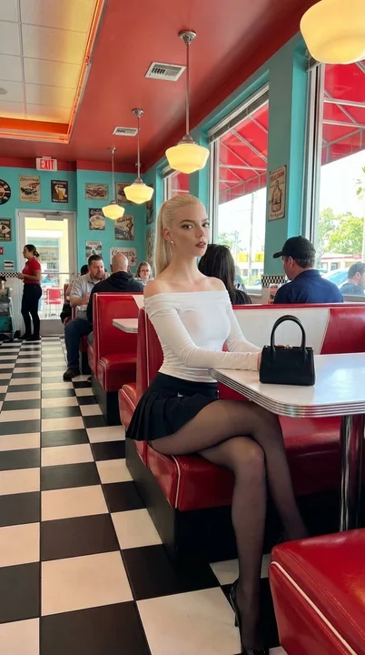 Blonde fashion icon in a retro restaurant