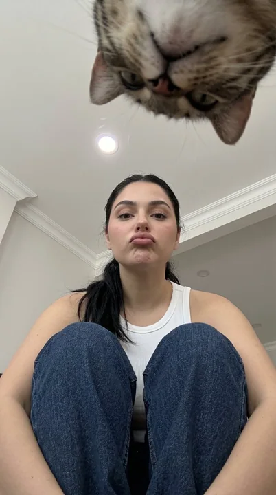 Low angle shot of a cowboy girl holding her knees