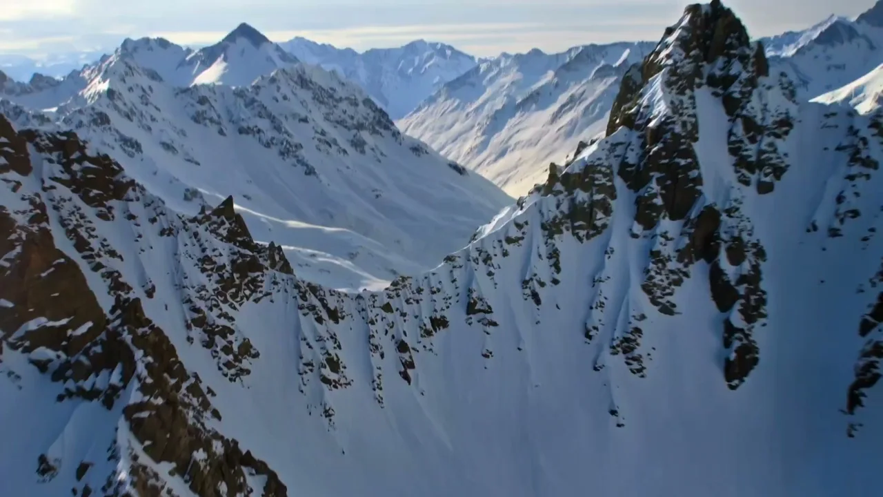 Aerial footage of the extreme chase between an avalanche and a train