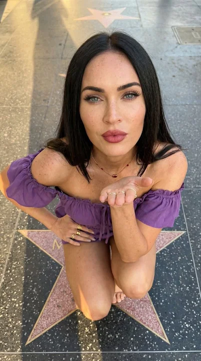 A stunning beauty on the Avenue of Stars, looking up at the camera from an overhead shot